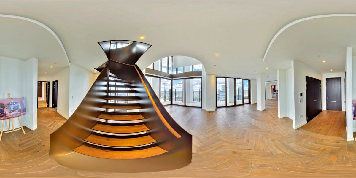 Sculptural statement staircase in steel and timber connecting the two principal floors